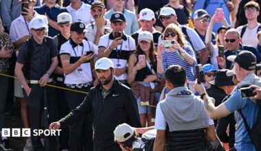 Scottie Scheffler walking past spectators during the 2025 Open Championship at Royal Portrush