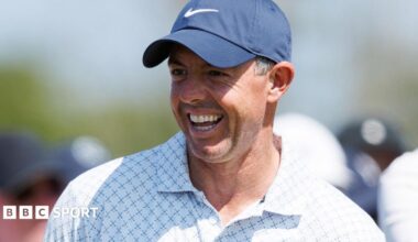 Rory McIlroy laughs during his round