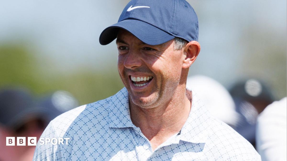 Rory McIlroy laughs during his round