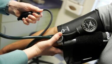 A doctor taking a patient’s blood pressure measurement.