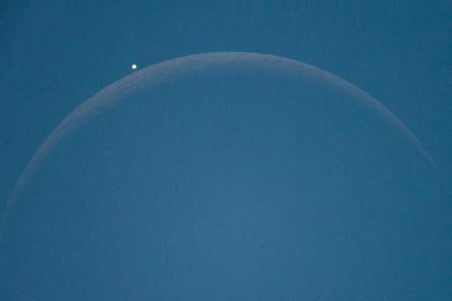 Lunar Occultation Of Venus At Telescope From Italy Lunar occultation of Venus planet is seen through a telescope from L'Aquila, Italy, on September 19th, 2025. Venus disappeared behind the moon for about one hour during the afternoon. The astronomical show was visible through a telescope, a binocular or a photo camera associated to telephoto lens. (Photo by Lorenzo Di Cola/NurPhoto via Getty Images)