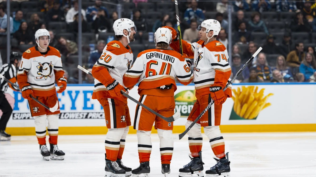 Anaheim Ducks forward Chris Kreider (20) and forward Mikael Granlund (64) and defenseman John Carlson (74) celebrate Granlund
