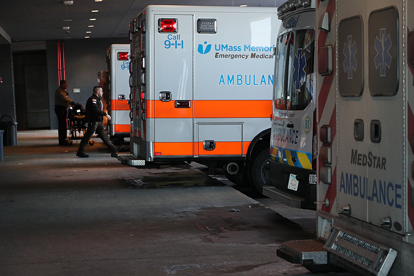 EMTs transferred and delivered patients in the busy ambulance bay at UMass Memorial Medical Center.
