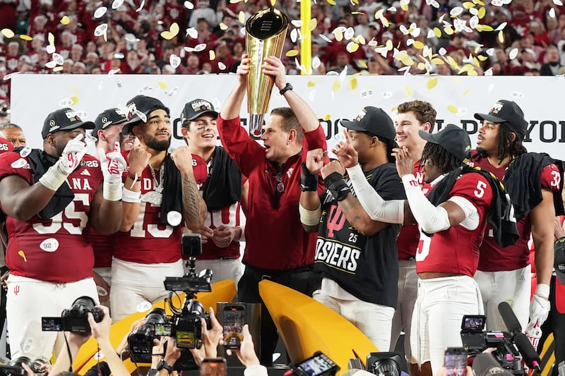 Indiana head coach Curt Cignetti holds the trophy after their win against Miami in the College Football Playoff national championship game, Monday, Jan. 19, 2026, in Miami Gardens, Fla.