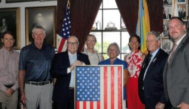 Local artist presents original flag painting to Joe Wilson