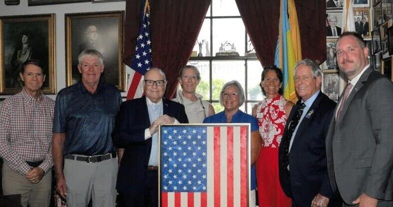 Local artist presents original flag painting to Joe Wilson