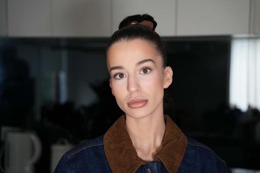 A close up of a young woman with dark hair 