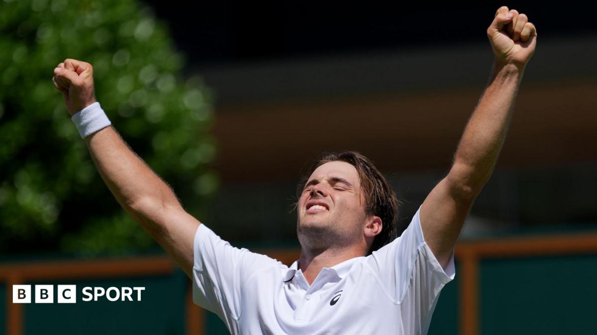 Arthur Fery covers his face as he celebrates winning at Wimbledon