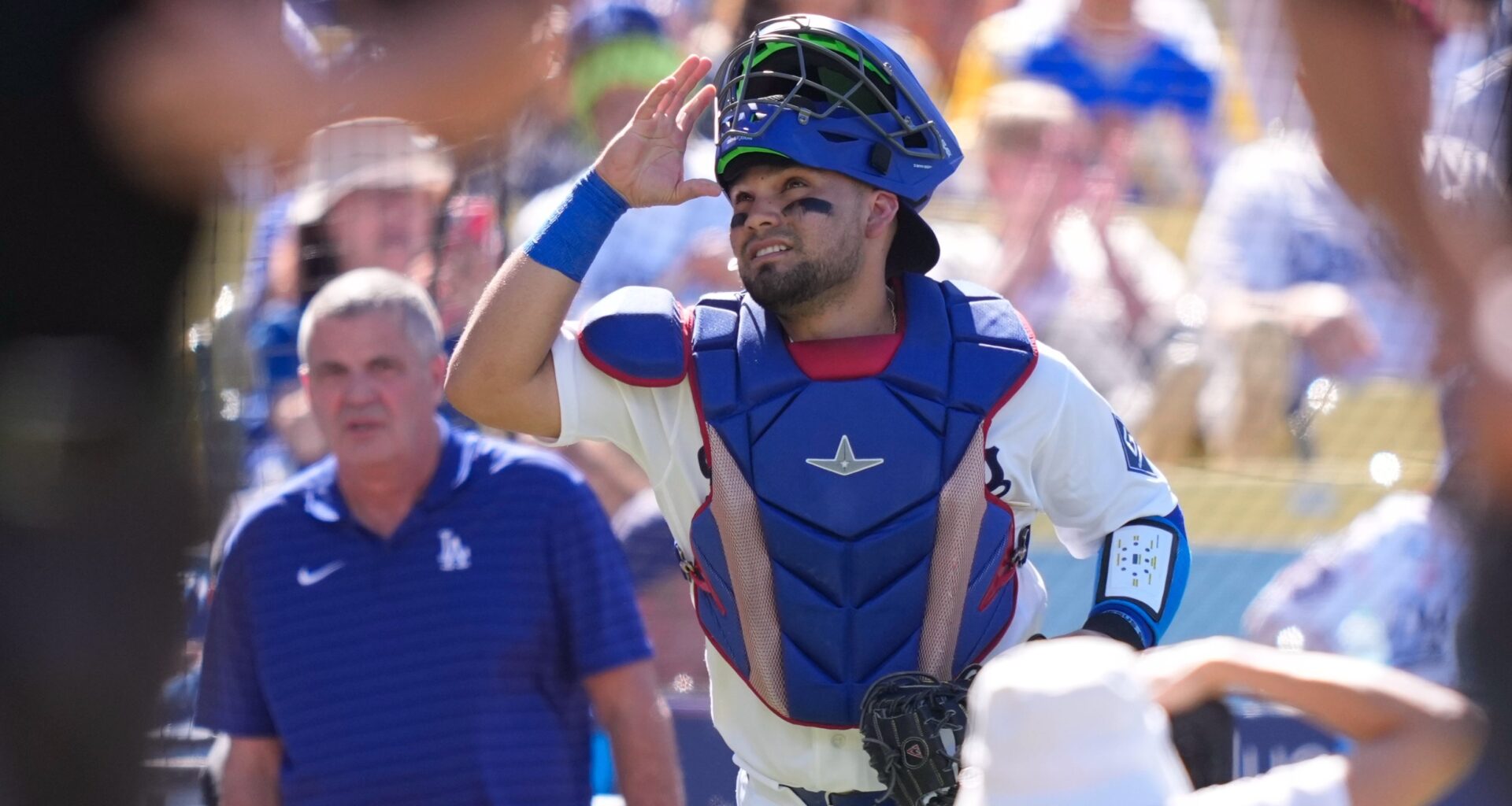 Los Angeles Dodgers catcher Eliezer Alfonzo looks toward the sky as he takes the field prior to a baseball game against the San Diego Padres, Sunday, July 5, 2026, in Los Angeles. (AP Photo/Mark J. Terrill)