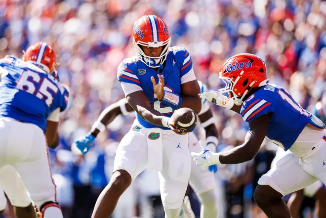 DJ Lagway of the Florida Gators hands the ball off