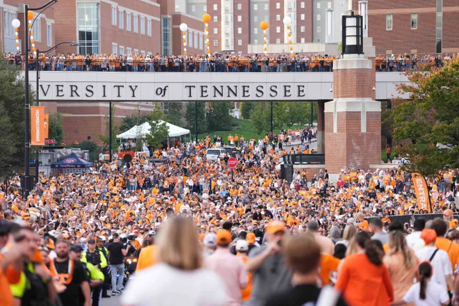 Tennessee fans mingle during the Vol Walk before an NCAA college football game between Tennessee and Mississippi State at Neyland Stadium in Knoxville, Tenn., Saturday, Nov. 3, 2024.