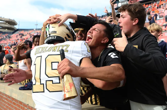 Nov 2, 2024; Auburn, Alabama, USA; Vanderbilt Commodores quarterback Blaze Berlowitz (19) celebrates with fans after the Commodores beat the Auburn Tigers at Jordan-Hare Stadium. Mandatory Credit: John Reed-Imagn Images