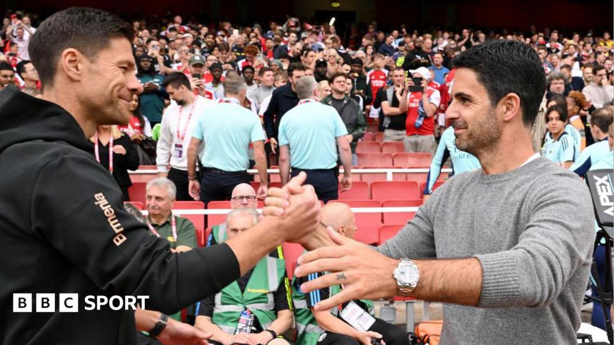 Xabi Alonso, Head Coach of Bayer 04 Leverkusen, interacts with Mikel Arteta, Manager of Arsenal, prior to the pre-season friendly match between Arsenal and Bayer 04 Leverkusen at Emirates Stadium