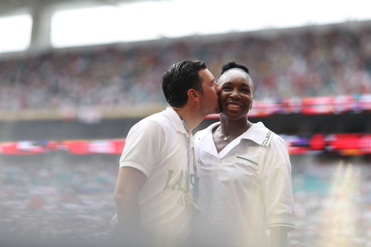 US tennis player Venus Williams is kissed by her husband Andrea Preti 