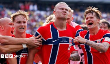 Erling Haaland leads the Norway team in the 'Viking row' celebration following their 2-1 victory over Brazil.