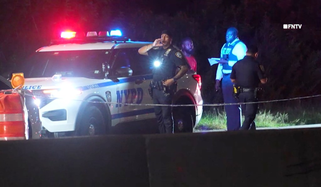Police at the scene of an assault investigation on the Belt Parkway in Queens, NY.