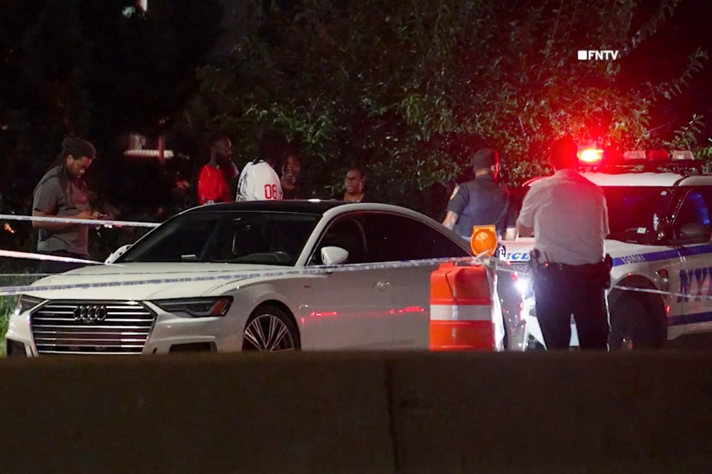Police investigate an assault on Belt Parkway in Queens, NY.