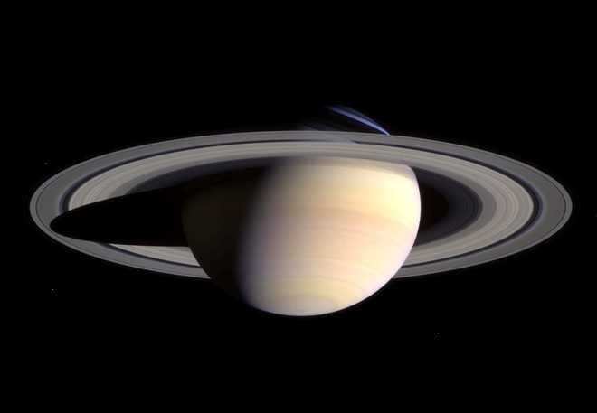 Latest Images From NASA's Cassini Probe to Saturn Saturn's peaceful beauty invites the Cassini spacecraft for a closer look in this natural color view, taken during the spacecraft's approach to the planet. By this point in the approach sequence, Saturn was large enough that two narrow angle camera images were required to capture an end-to-end view of the planet, its delicate rings and several of its icy moons. The composite is made entire from these two images. Moons visible in this mosaic: Epimetheus (116 kilometers, 72 miles across), Pandora (84 kilometers, 52 miles across) and Mimas (398 kilometers, 247 miles across) at left of Saturn; Prometheus (102 kilometers, 63 miles across), Janus (181 kilometers, 113 miles across) and Enceladus (499 kilometers, 310 miles across) at right of Saturn. (Photo by NASA/WireImage) *** Local Caption ***