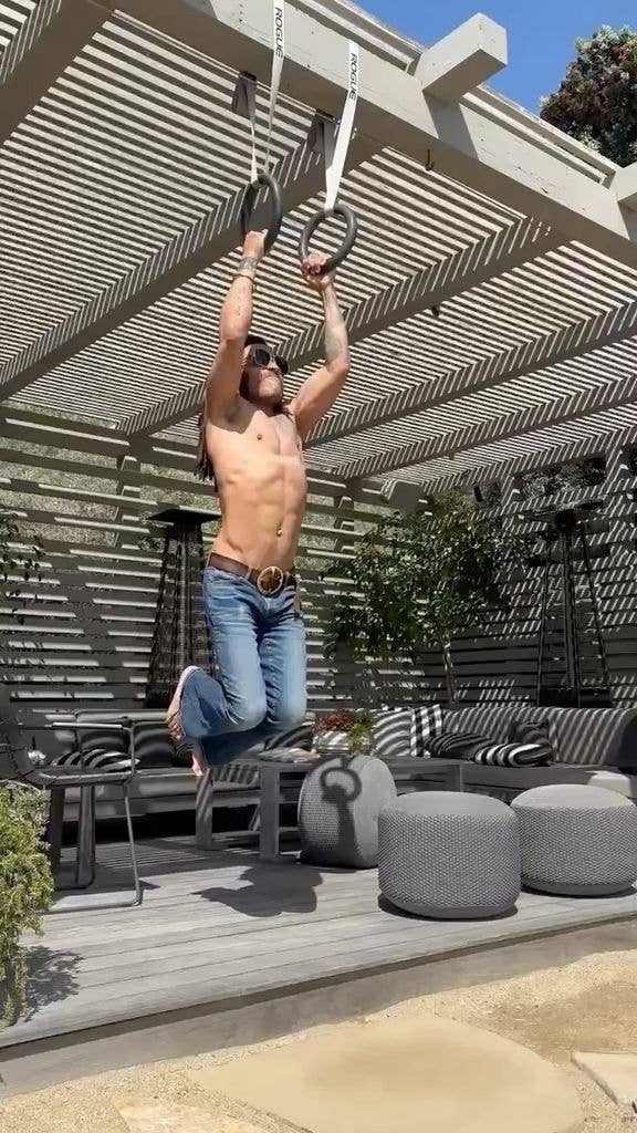 Lenny Kravitz trains using exercise rings at his home in jeans, shared on Instagram in 2024