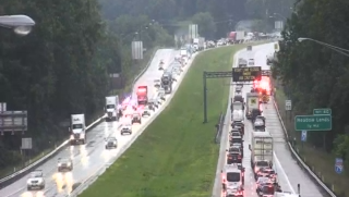 Tanker truck crashes over hillside, losing tires that then hit tractor-trailer on I-79