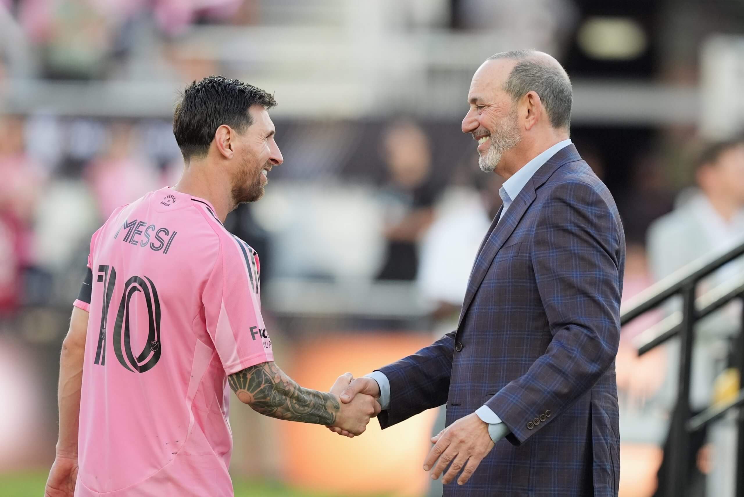Lionel Messi shakes hands with Don Garber