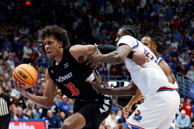 Clippers rookie forward Baba Miller, left, was the first Cincinnati player since Hall-of-Famer Oscar Robertson to lead the Bearcats in points (13), rebounds (10.3) and assists (3.7) per game in the same season. (AP Photo/Colin E. Braley)