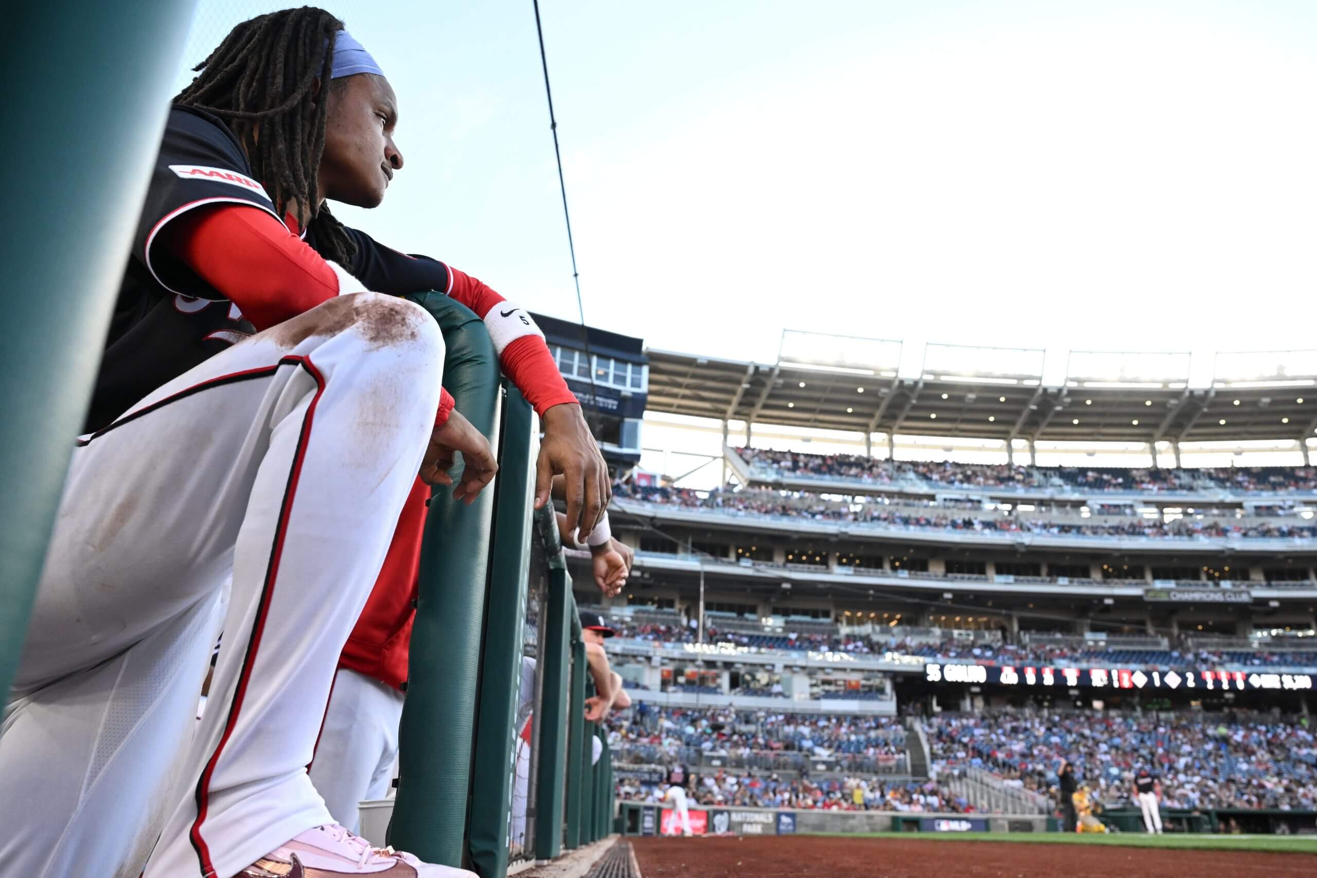 CJ Abrams looks from the dugout at Nationals Park.