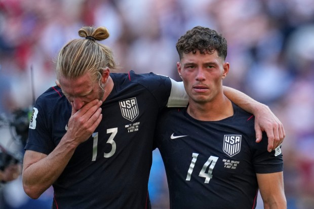 United States' Sebastian Berhalter, right, and Tim Ream react after the United States lost a World Cup Round of 16 soccer match against Belgium in Seattle, Monday, July 6, 2026. (AP Photo/Abbie Parr)