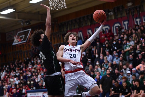 MORAGA, CALIFORNIA - FEBRUARY 25: Campolindo's Aidan Mahaney (20) goes up for a lay up against De La Salle's Javon Johnson (24) during their North Coast Section Open Division championship game at Campolindo High School in Moraga, Calif., on Friday, Feb. 25, 2022. Campolindo defeated De La Salle 51-50. (Jose Carlos Fajardo/Bay Area News Group)