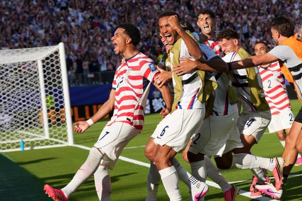 United States' Malik Tillman (17) celebrates with teammates after scoring on a free kick during the World Cup round of 32 soccer match between the United States and Bosnia in Santa Clara, Calif., near San Francisco, Wednesday, July 1, 2026. (AP Photo/Martin Meissner)