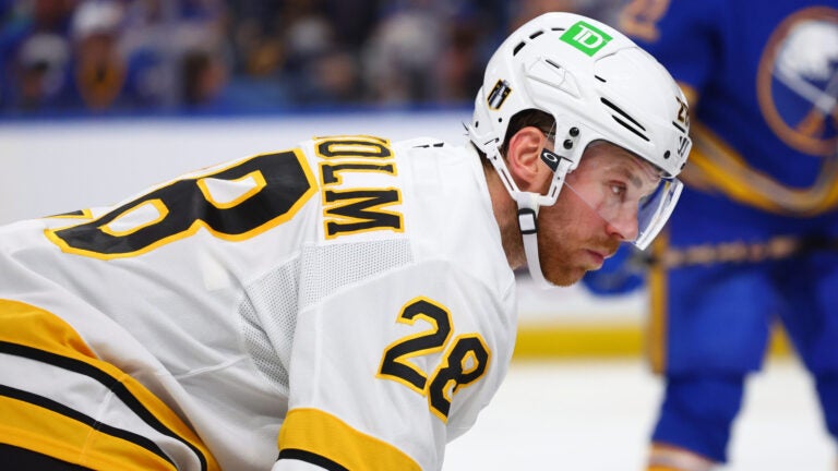 Boston Bruins center Elias Lindholm (28) lines up for a faceoff during the second period in Game 1 of a first-round NHL hockey Stanley Cup playoff series against the Buffalo Sabres Sunday, April 19, 2026, in Buffalo, N.Y.