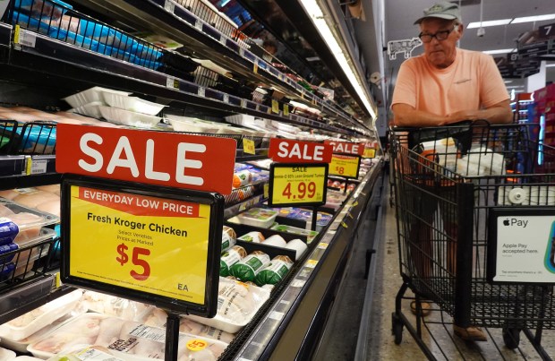 A shopper browses near "Sale" signs in the meats section of a grocery store on July 7, 2026, in Pasadena, California. (Mario Tama/Getty)