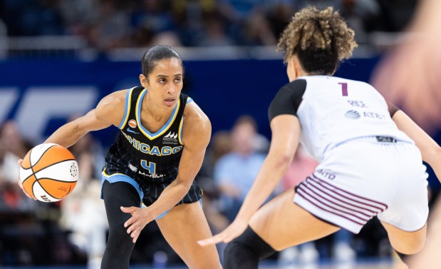Chicago Sky guard Skylar Diggins carries the ball against Toronto Tempo guard Kiki Rice in the third quarter of a game at Wintrust Arena in Chicago on Wednesday, May, 27, 2026. (Josh Boland/Chicago Tribune)