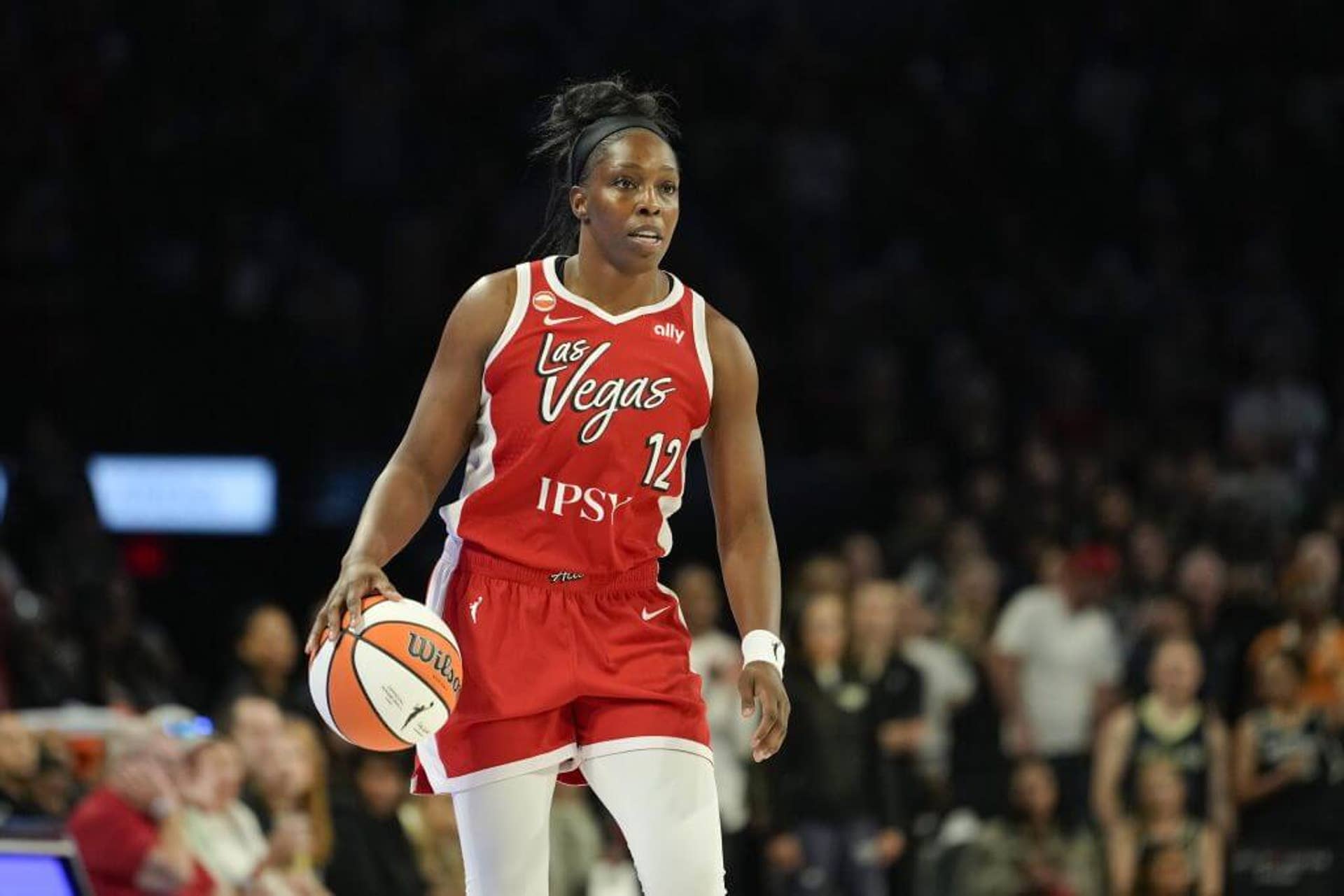 Chelsea Gray of the Las Vegas Aces dribbles the ball against the Dallas Wings.