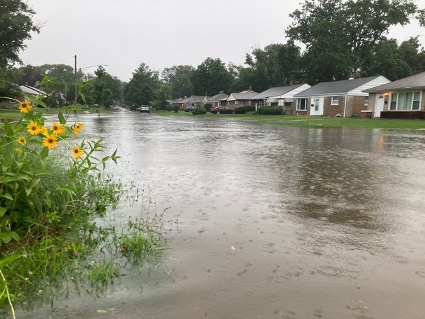 Stormwater collects on Spruce Road in Homewood after heavy rains Saturday, July 4, 2026. It was the second torrential rain to hit the area in less than 24 hours after a storm the night before left roadways similarly flooded, closed viaducts and damaged trees. (Paul Eisenberg/Daily Southtown)