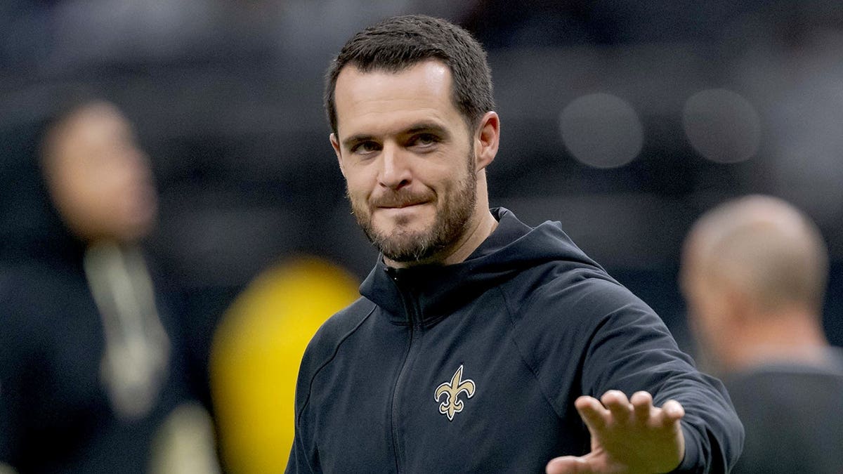 Derek Carr walks on the field at Caesars Superdome.