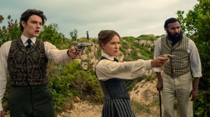 Enola Holmes 3. (L to R) Louis Partridge as Tewkesbury, Millie Bobby Brown as Enola Holmes and Himesh Patel as Dr. Watson in Enola Holmes 3. Cr. John Wilson/Netflix ©2026