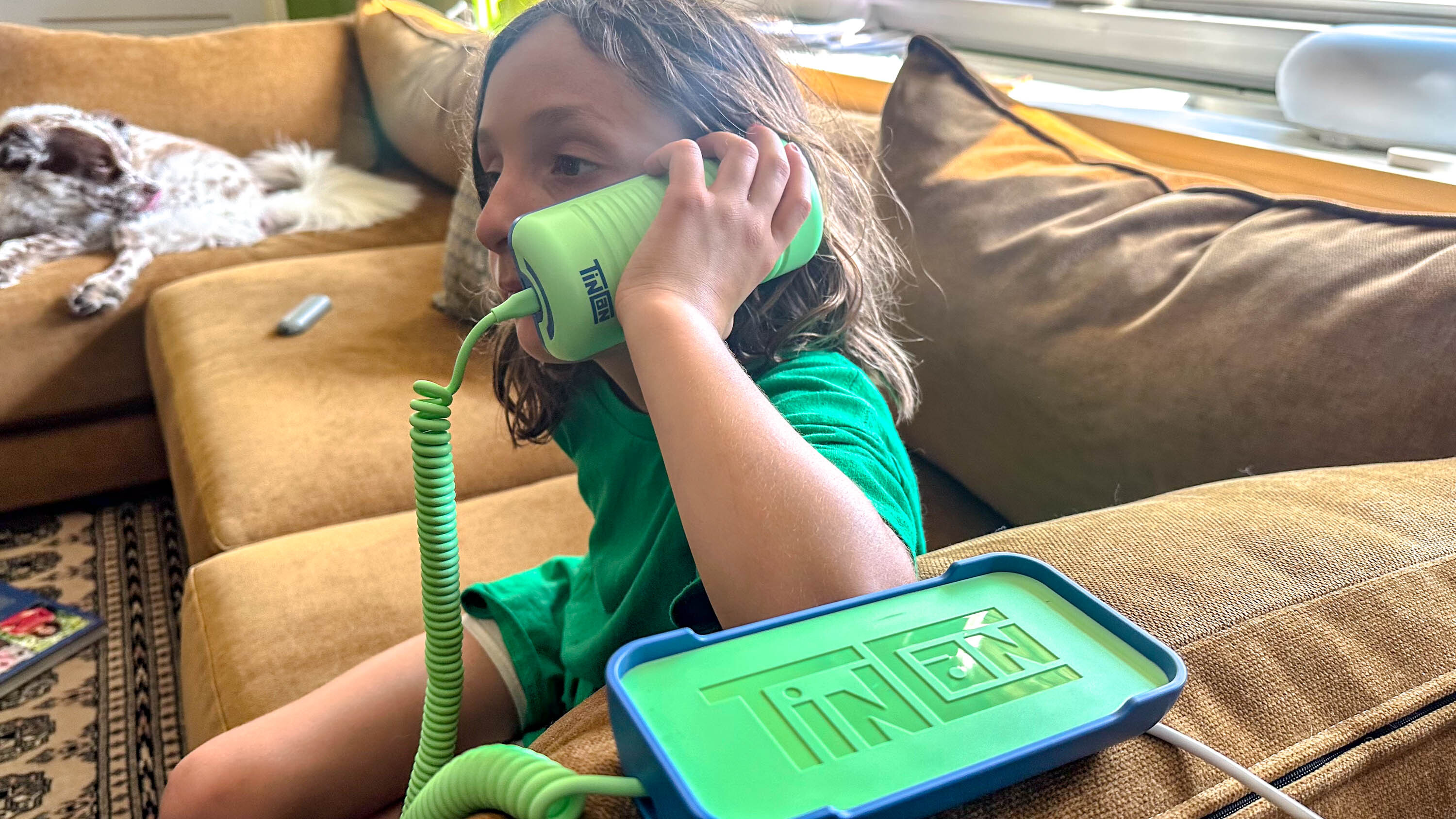 girl talking on Tin Can phone