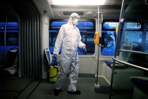 A employee wearing a protective jumpsuit disinfects a local tram in Zagreb as a precaution against the spread of COVID-19 caused by novel coronavirus on March 13, 2020. - Since the novel coronavirus first emerged in late December 2019, more than 135,640 cases have been recorded in 122 countries and territories, killing 5,043 people, according to an AFP tally compiled on March 13, 2020 based on official sources. (Photo by Damir SENCAR / AFP) (Photo by DAMIR SENCAR/AFP via Getty Images)