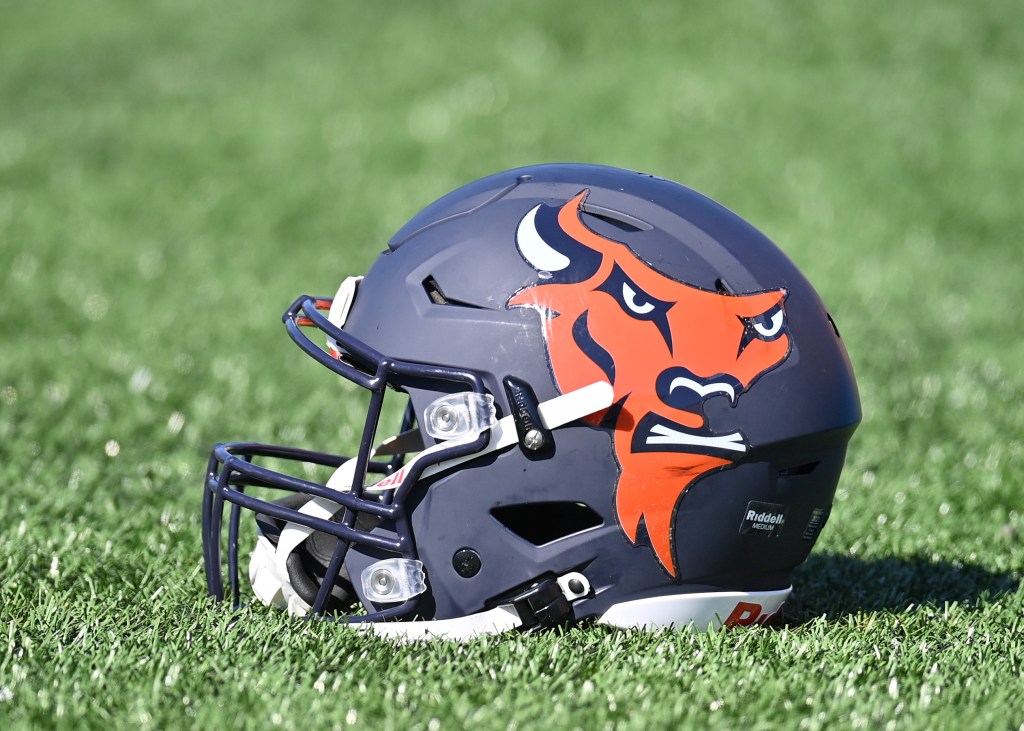Bucknell Bison football helmet on a grassy field.