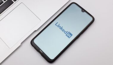 LinkedIn mobile app displayed on smartphone set on desk