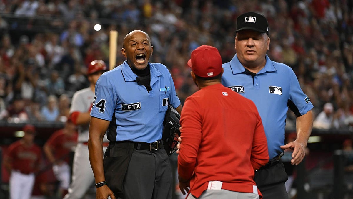 Oliver Marmol shouts at an MLB umpire
