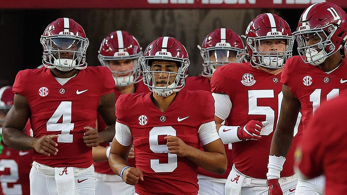 Bryce Young runs out with the team before Texas A&M game