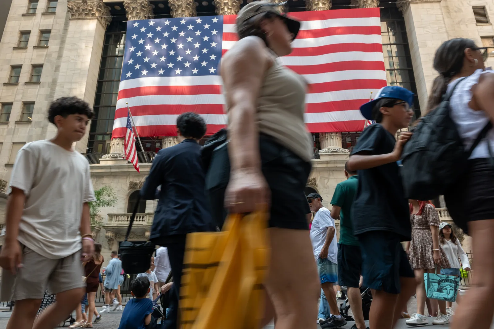 NEW YORK, NEW YORK - JULY 05: People walk by the New York Stock Exchange (NYSE) on July 05, 2024 in New York City. The Bureau of Labor Statistics reported Friday that U.S. employers added 206,000 jobs in June, more than expected and slightly below the revised 218,000 added in May.  (Photo by Spencer Platt/Getty Images)
