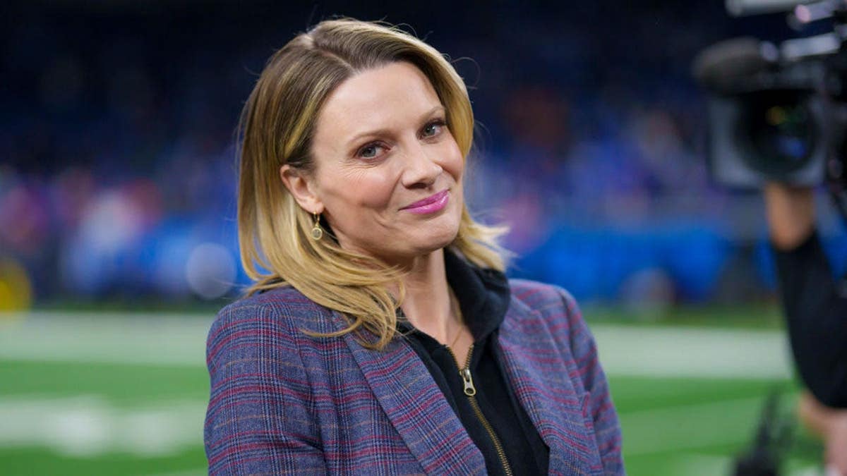 Stacey Dales stands on the field at Ford Field.