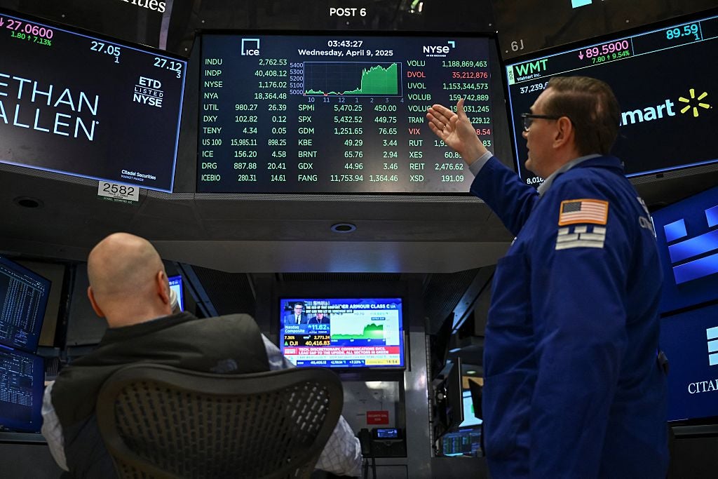 Traders work on the floor of the New York Stock Exchange on April 9, 2025, after Trump announced he was pausing the trade tariffs for 90 days