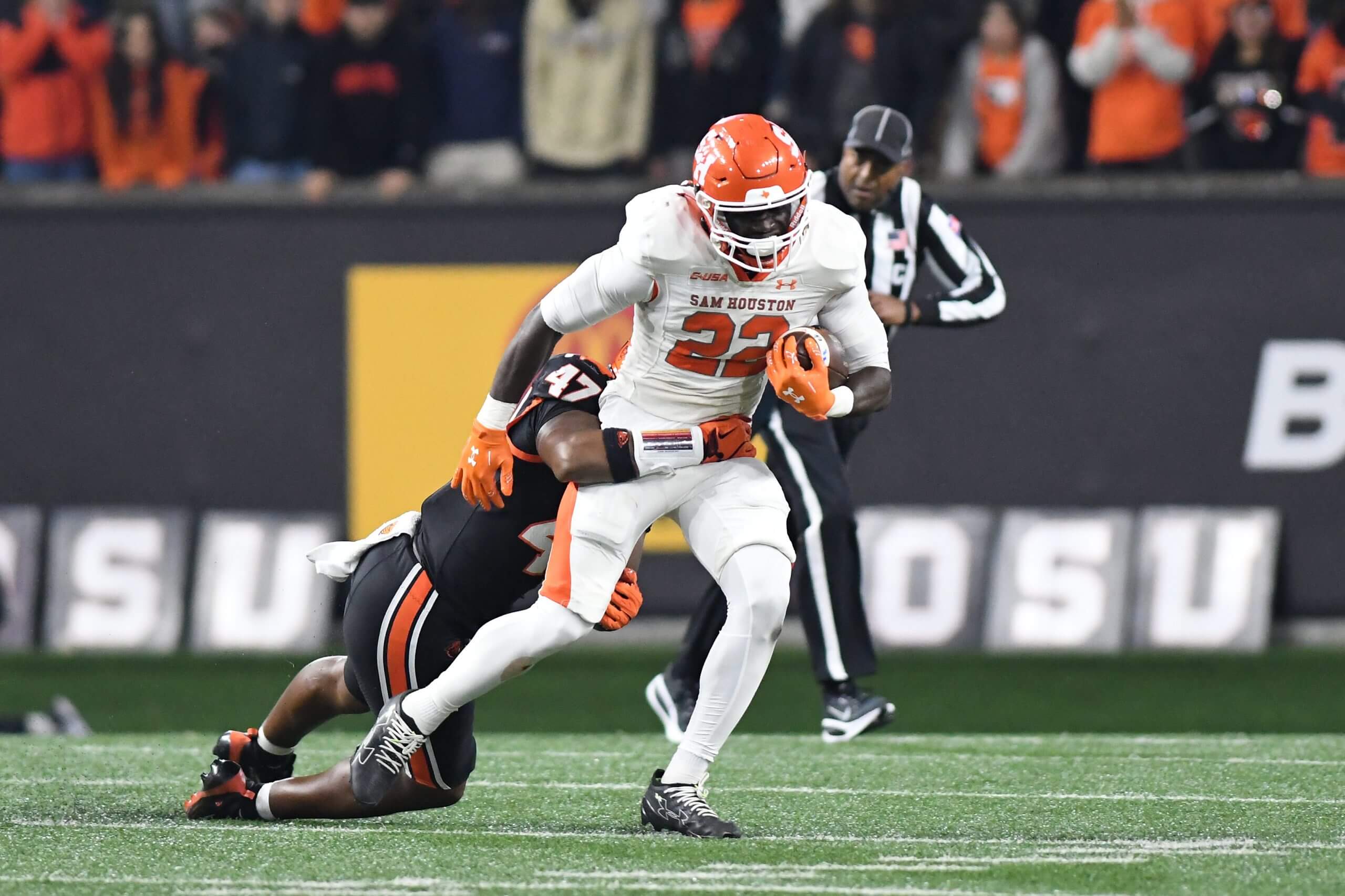 Alton McCaskill of Sam Houston tries to break a tackle during a game.