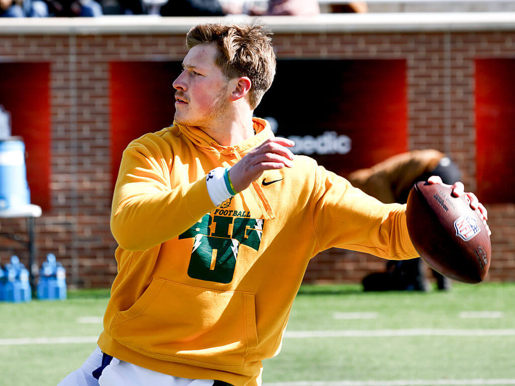 Cole Payton prepares to throw a pass.
