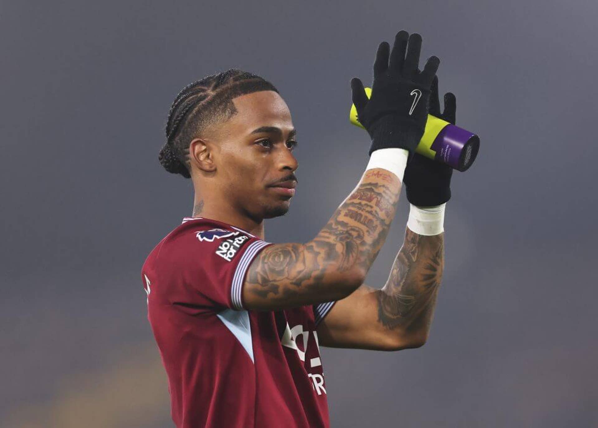 Crysencio Summerville applauds West Ham fans while holding a player of the match award