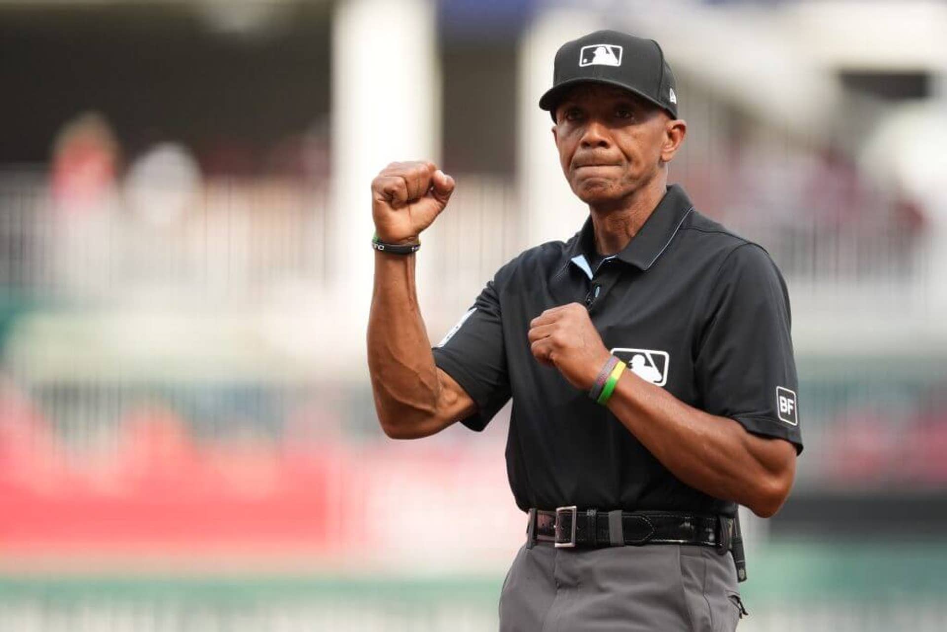 First-base umpire CB Bucknor makes the call during a game between the Boston Red Sox and the Cincinnati Reds.